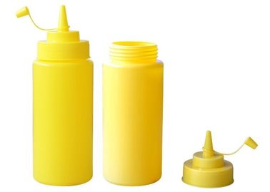 Butelki z żółtego plastiku sosu spożywczego z nakrętką sosu, butelka sosu wyciskanego
